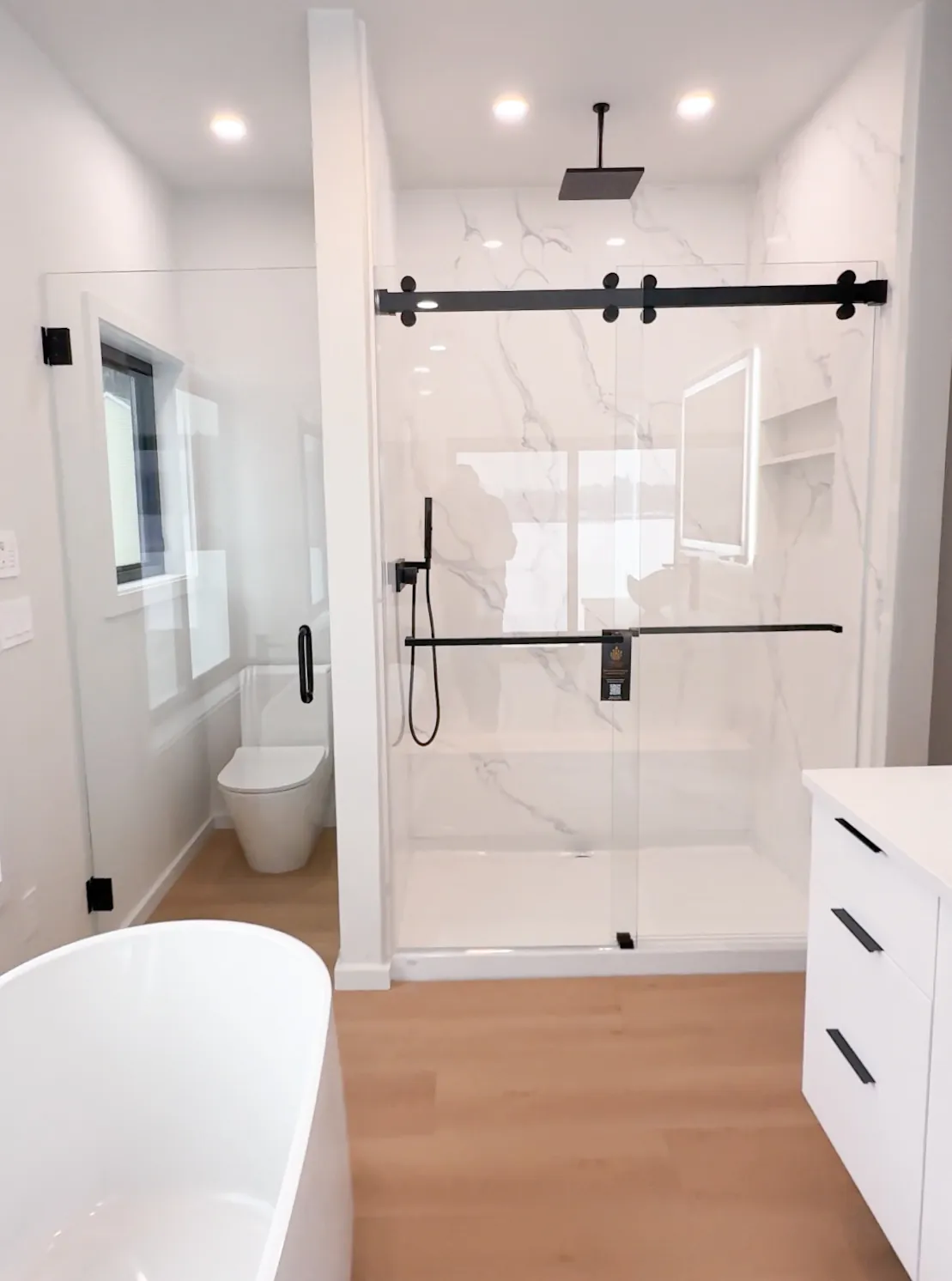 Sliding shower door with black frame